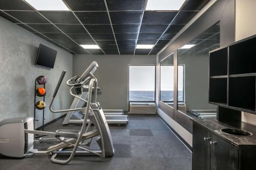 a room with a gym with a view of the ocean at MainStay Suites Springfield IL in Springfield