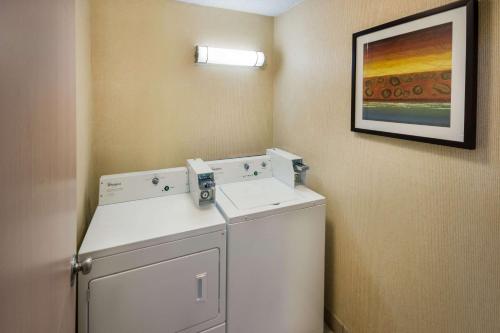 a laundry room with a washer and dryer at Quality Inn & Suites Bozeman in Bozeman