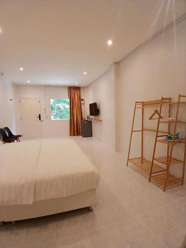 a bedroom with a bed and a ladder in it at ฮัก ณ หนองคายโคซี่วิลล์ Hug Na Nongkhai Cozy Ville in Nong Khai