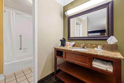 a bathroom with a sink and a mirror at Quality Inn Morgan City in Morgan City