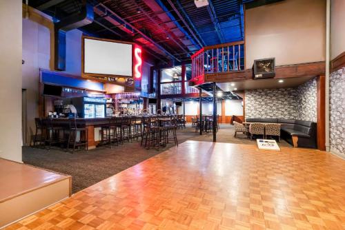a large room with a bar and a stage at Quality Inn Morgan City in Morgan City