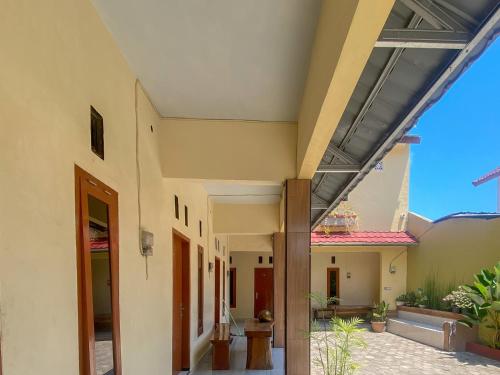 an internal view of a house with a patio at Urbanview Griya Lota Guest House Banyuwangi in Ketapang