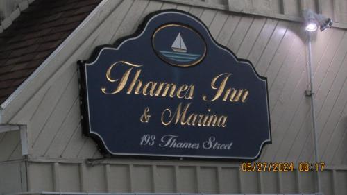 a sign for ahmara inn andumeulum on a building at Thames Inn and Marina in Groton