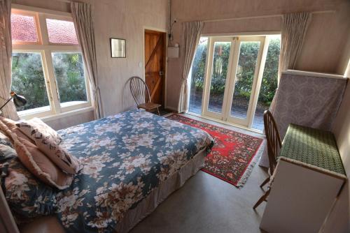 Postel nebo postele na pokoji v ubytování Mountain View Cottage