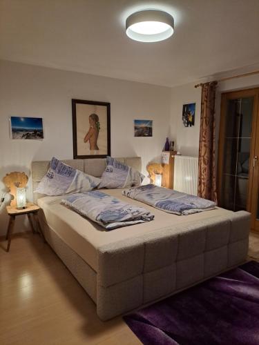 A bed or beds in a room at Ferienwohnung Felix-Adults Only