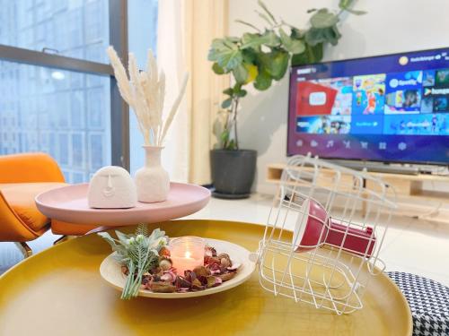 a table with a plate of food and candles on it at X - The Nordic - Icon City Petaling Jaya in Sungai Way