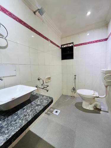Koupelna v ubytování Hotel Shripad