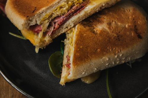 a sandwich is cut in half on a plate at Tullah Lakeside Lodge in Tullah
