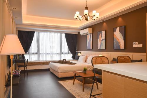 a hotel room with a bed and a large window at R&F Princess Cove by Nest Home at Johor Bahru in Johor Bahru