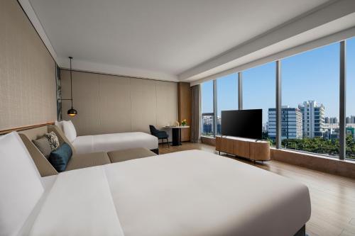 Postel nebo postele na pokoji v ubytování Crowne Plaza Sanya Yazhou Bay by IHG