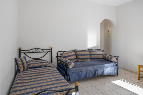 two beds sitting next to each other in a room at Katerina Irida Kythnos in Mérikhas