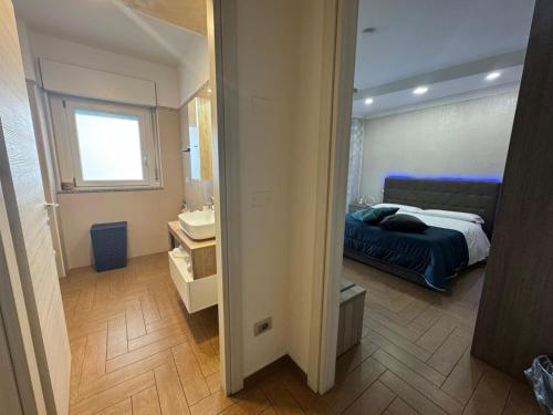 Ένα ή περισσότερα κρεβάτια σε δωμάτιο στο B&B Palazzo del Toro