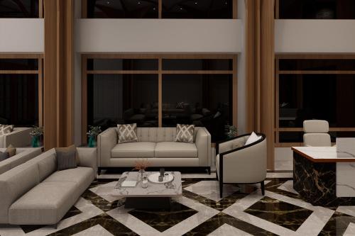 a living room with a couch and a table at Nirvana Grand Hotel & Resort in Gaya