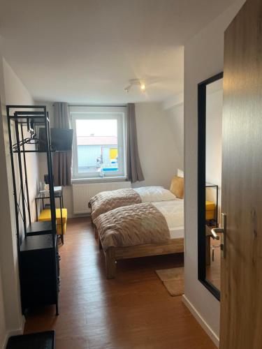 a bedroom with a bed and a bunk bed at Truckcenter Fehrbellin an der A24 in Fehrbellin