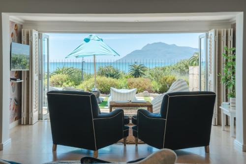 a living room with a view of the ocean at Last Word Long Beach in Kommetjie