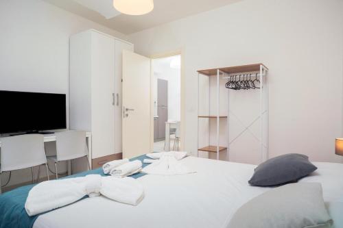 Postel nebo postele na pokoji v ubytování mungiBEDdu Apartment