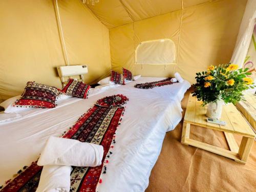 Postel nebo postele na pokoji v ubytování Suly's Village Phan Thiết