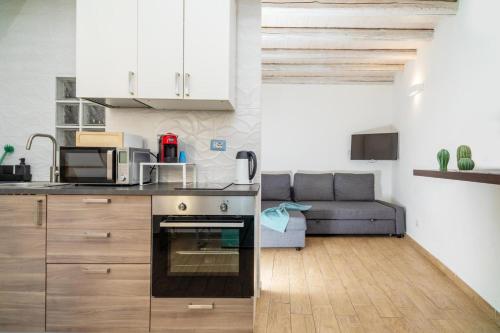 Kuchyň nebo kuchyňský kout v ubytování mungiBEDdu Apartment
