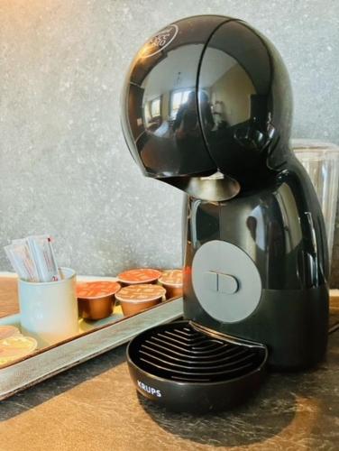 a coffee maker sitting on top of a counter at Luxe Appartementen Leonardus in Valkenburg