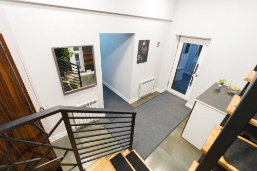 an empty hallway with a staircase and a door at GH Family Hotel in Yerevan