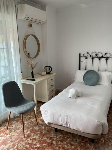 Ένα ή περισσότερα κρεβάτια σε δωμάτιο στο Hostal San Miguel by Croma