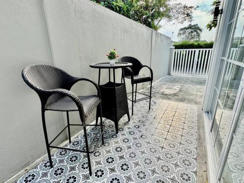 two chairs and a table on a patio at Casa Leonardo-Bel Air 4 in Santa Rosa