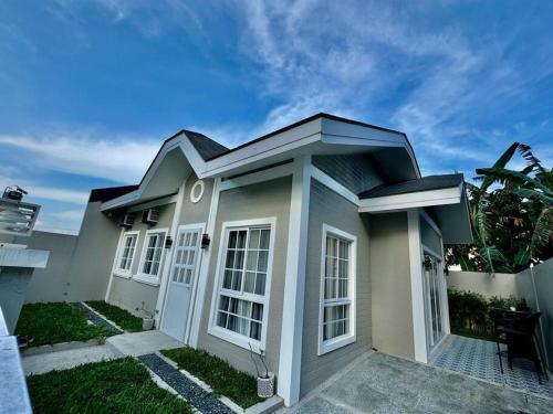 a small white house with a lot of windows at Casa Leonardo-Bel Air 4 in Santa Rosa