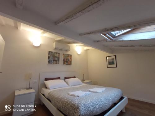 a bedroom with a bed with two towels on it at Casa Vacanze Francesco in Florence