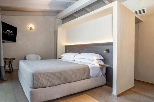 a bedroom with a large bed in a room at Stazzo Lu Ciaccaru in Arzachena