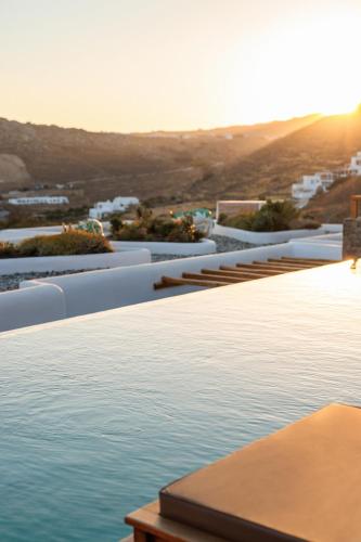 a swimming pool with a view of the water at Mileo in Kalo Livadi