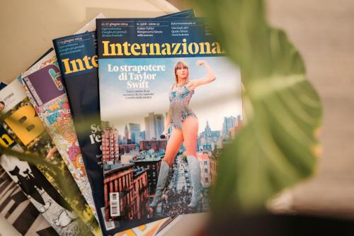 a magazine with a woman on the cover at Tomato Urban Retreat in Turin