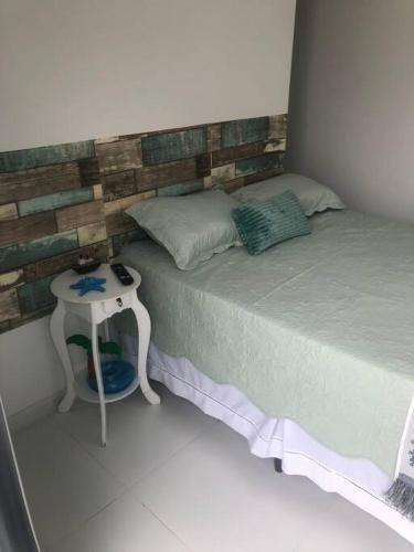 Katil atau katil-katil dalam bilik di Casa em Arembepe com quatro suítes