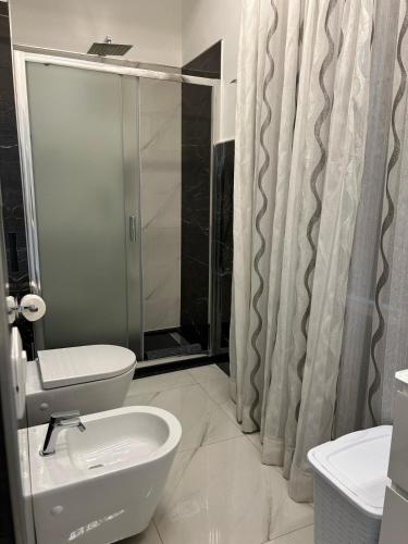 a bathroom with a shower and a toilet and a sink at B&B Il Sogno in Lamezia Terme