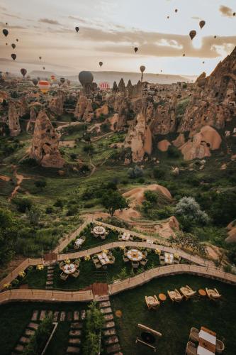 an aerial view of a resort with hot air balloons at Via Regia Cappadocia Hotel in Uchisar