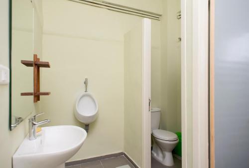 a bathroom with a sink and a toilet at The Grand Meshmosh Hotel in Beirut
