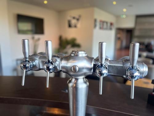 a close up of a metal water fountain at Ambiance Hotel in Limas