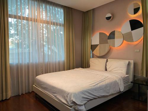 Postelja oz. postelje v sobi nastanitve Huang Su Villa 5 皇宿5号泳池别墅
