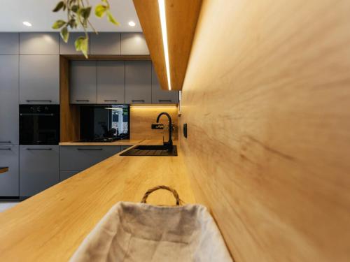a kitchen with a wooden counter with a bag on it at Holiday Home Lozo by Interhome in Gornji Proložac