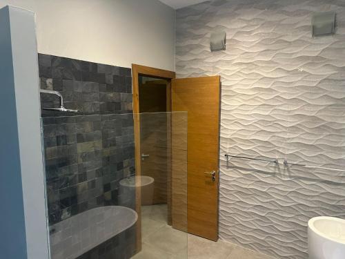 a bathroom with a shower and a glass door at Phuket 4-Bedrooms Seaview 884m2 Private XL Luxury Infinity Pool Villa in Ban Pa Khlok