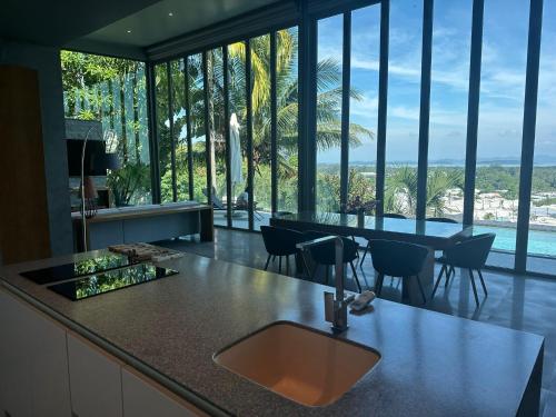 a kitchen with a sink and a counter with a view at Phuket 4-Bedrooms Seaview 884m2 Private XL Luxury Infinity Pool Villa in Ban Pa Khlok