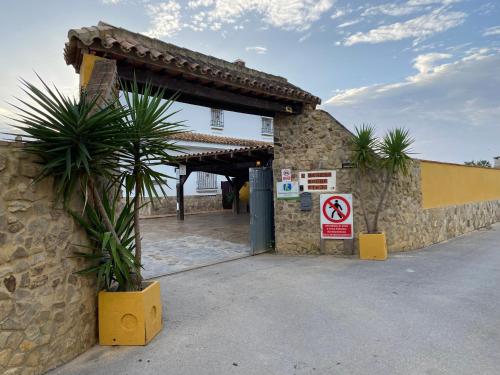 a building with ano smoking sign in front of it at Villas Dehesa Roche Viejo in Conil de la Frontera