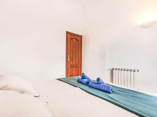 a room with two blue pillows on a bed at Holiday Home Villa Brava by Interhome in Calonge