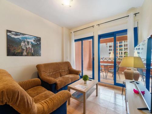 a living room with two couches and a table at Apartment Verdemar by Interhome in Playa Honda