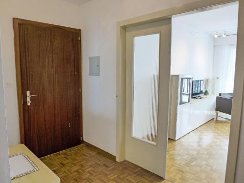a hallway with a door leading to a living room at Apartment Marigny Dent-Blanche 25 by Interhome in Crans-Montana