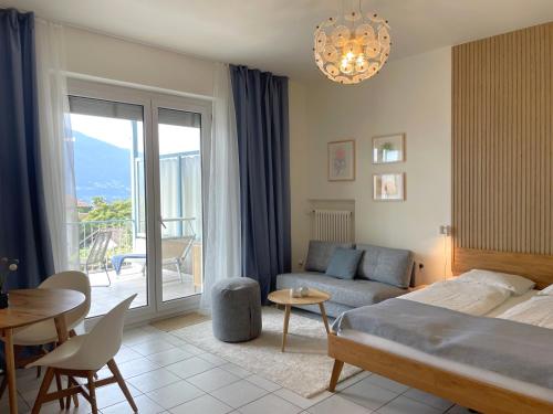 Ένα ή περισσότερα κρεβάτια σε δωμάτιο στο Azzurro by Fewotessin