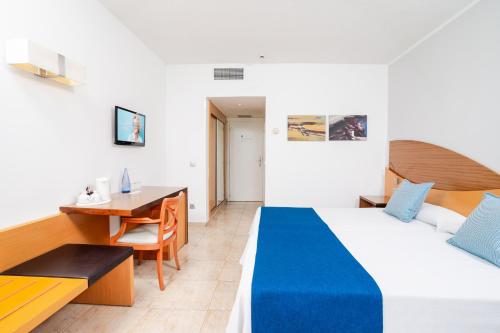 a hotel room with a bed and a desk at HOVIMA Costa Adeje - For Cool Adults in Adeje