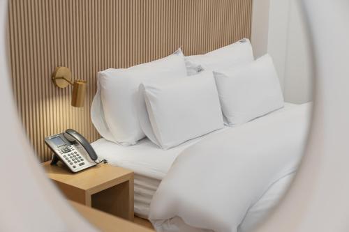 Postel nebo postele na pokoji v ubytování Hotel YAJA Namchuncheon