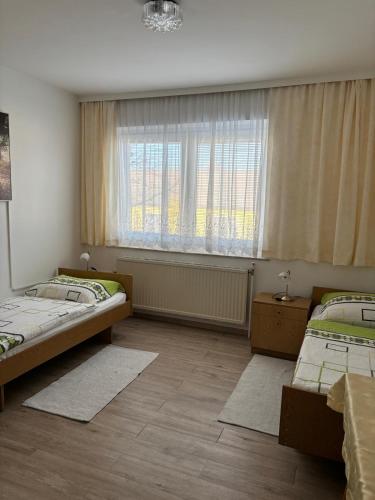 Postel nebo postele na pokoji v ubytování Pension Eicher