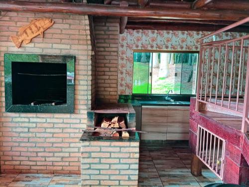 TV a/nebo společenská místnost v ubytování Recanto Aconchego