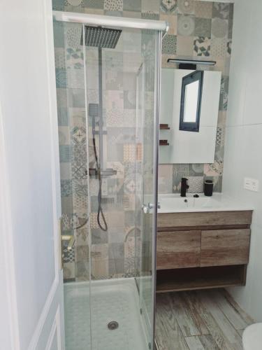 a bathroom with a shower and a sink at Villa Mirakai in Playa Honda